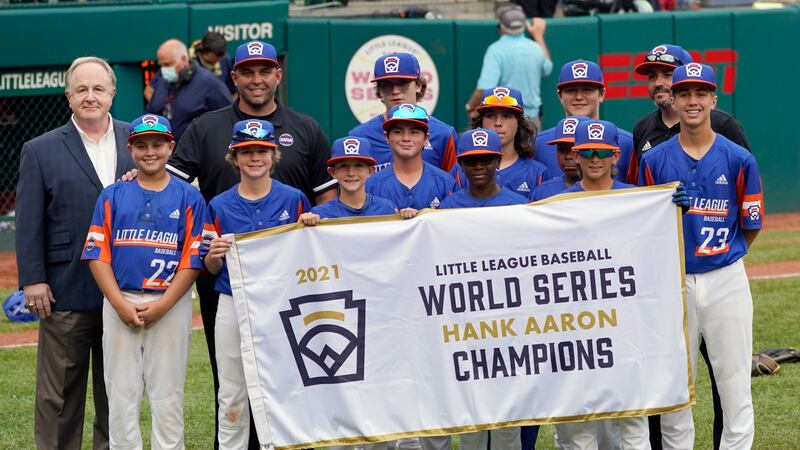 Taylor, Mich., poses with the Hank Aaron bracket champion banner after defeating Honolulu,...