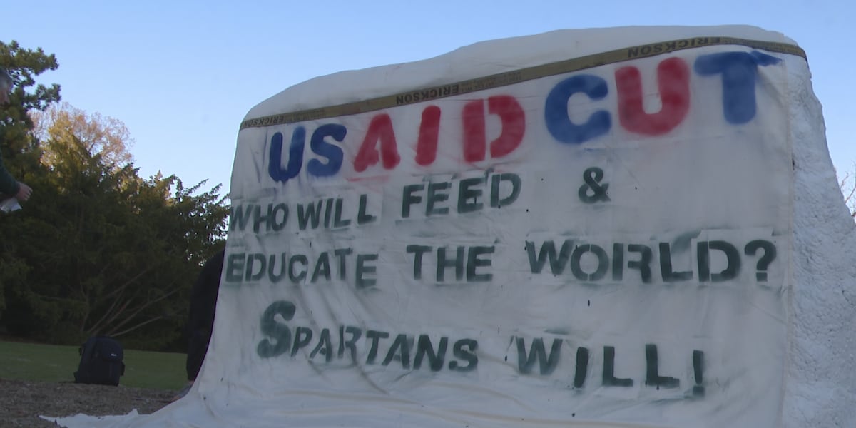 MSU researchers hold USAID funding cut rally at The Rock
