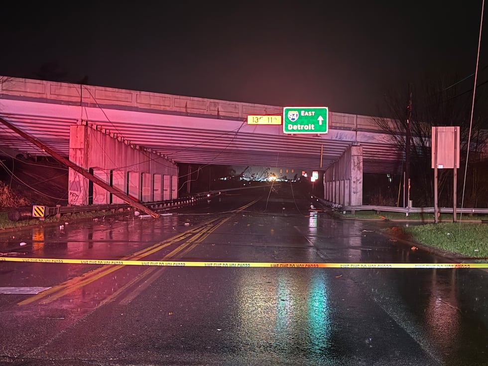 Downed power pole and wire near I-94 overpass in Ann Arbor