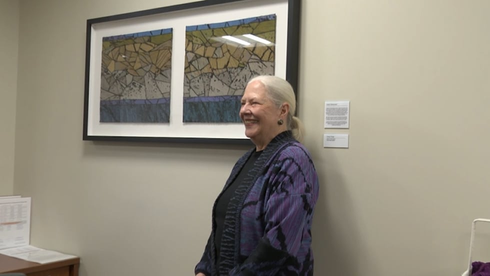 Chris Triola with her art piece for University of Michigan Health-Sparrow’s Herbert-Herman...